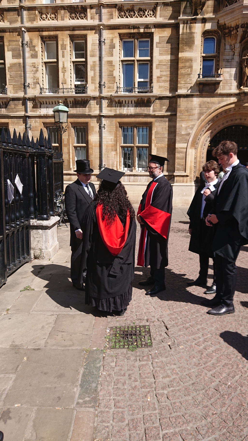 Graduates in gowns outside the Senate House